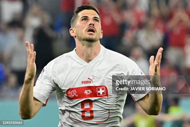 Switzerland's midfielder Remo Freuler celebrates after scoring his team's third goal during the Qatar 2022 World Cup Group G football match between...