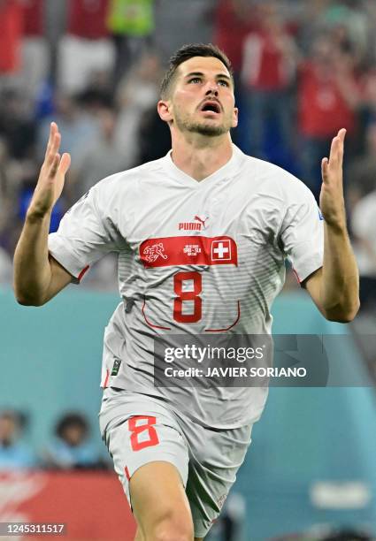 Switzerland's midfielder Remo Freuler celebrates after scoring his team's third goal during the Qatar 2022 World Cup Group G football match between...