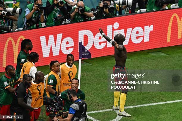 Cameroon's forward Vincent Aboubakar celebrates scoring his team's first goal during the Qatar 2022 World Cup Group G football match between Cameroon...