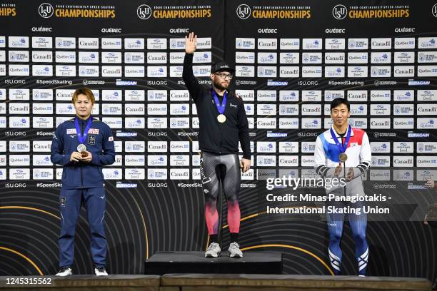 Yamato Matsui of Japan, Laurent Dubreuil of Canada and Jun-Ho Kim of the Republic of Korea pose with their medals after competing in the mens 500m...