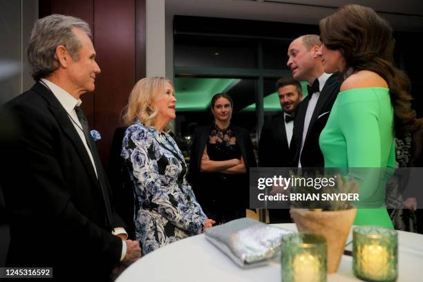 Britain's Prince William, Prince of Wales and Catherine, Princess of Wales, talk with Canadian actress Catherine O'Hara and her husband Bo Welch as...