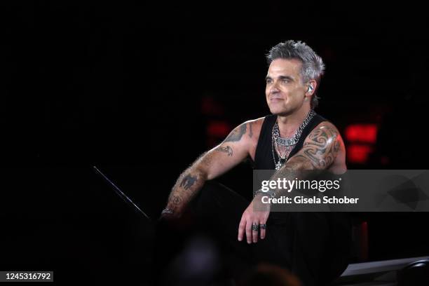 Singer Robbie Williams performs live on stage during his One Show & One Night Only concert at Messe Muenchen on August 27, 2022 in Riem/Munich,...