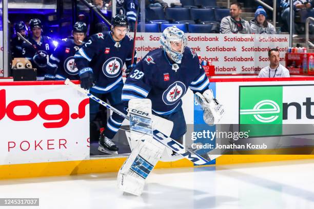 Goaltender David Rittich of the Winnipeg Jets hits the ice prior to puck drop against the Columbus Blue Jackets at the Canada Life Centre on December...