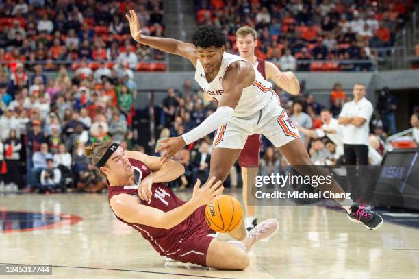 Dylan Cardwell of the Auburn Tigers attempts to steal the ball from Keegan Records of the Colgate Raiders during the first half of play at Neville...