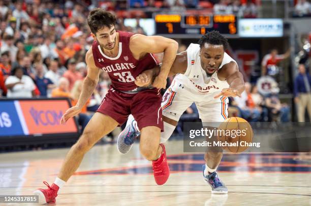 Chris Moore of the Auburn Tigers attempts to steal the ball from Oliver Lynch-Daniels of the Colgate Raiders during the first half of the game at...