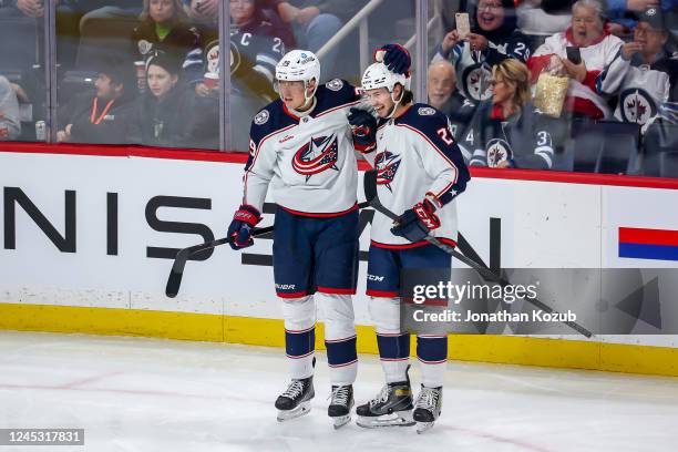 Patrik Laine and Andrew Peeke of the Columbus Blue Jackets celebrate a first period goal against the Winnipeg Jets at the Canada Life Centre on...