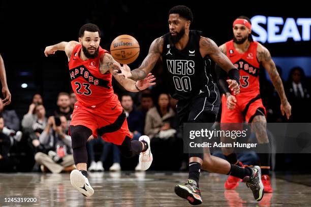 Royce O'Neale of the Brooklyn Nets chases down a loose ball in front of Fred VanVleet of the Toronto Raptors during the second half at Barclays...
