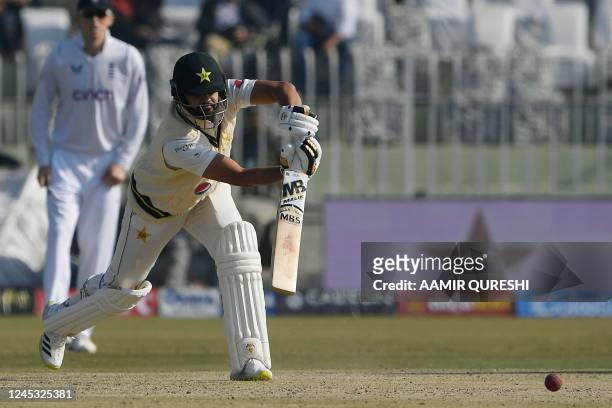 Pakistan's Azhar Ali plays a shot during the third day of the first cricket Test match between Pakistan and England at the Rawalpindi Cricket...