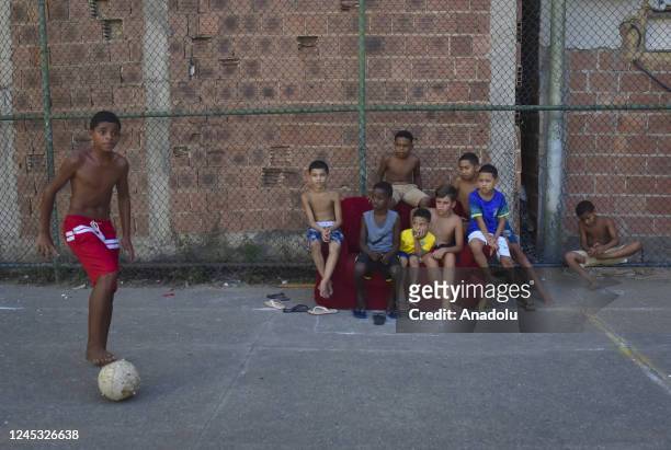 Children from Favela da Mare play soccer during the game between Brazil and Cameroon, Cameroon beat Brazil 1-0 in Rio de Janeiro, Brazil, on December...