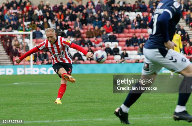 Alex Pritchard of Sunderland has a shot during the Sky Bet Championship between Sunderland and Millwall at Stadium of Light on December 3, 2022 in...