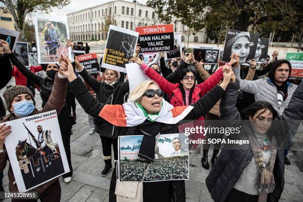 Protesters hold placards expressing their opinion during the demonstration. Mahsa Amini's death has sparked weeks of violent protests across Iran and...