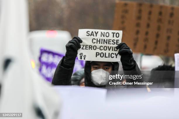 Demonstrators protest in front of the Chinese Embassy in solidarity with protesters in China on December 3, 2022 in Berlin, Germany. Protests have...