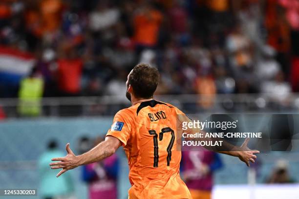 Netherlands' defender Daley Blind celebrates after he scored his team's second goal during the Qatar 2022 World Cup round of 16 football match...