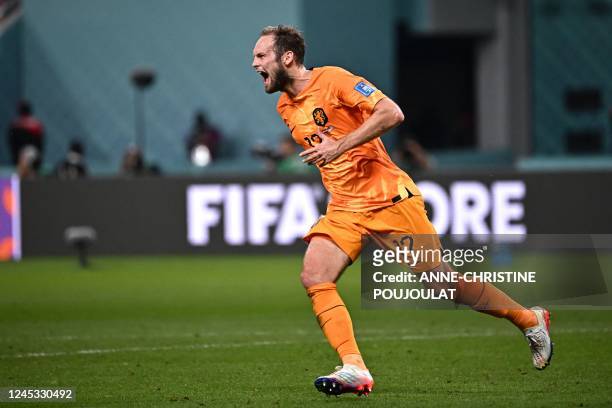 Netherlands' defender Daley Blind celebrates after he scored his team's second goal during the Qatar 2022 World Cup round of 16 football match...