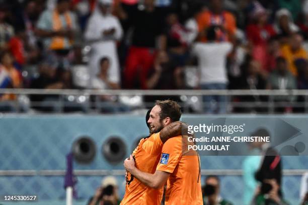 Netherlands' defender Daley Blind celebrates with Netherlands' forward Memphis Depay during the Qatar 2022 World Cup round of 16 football match...