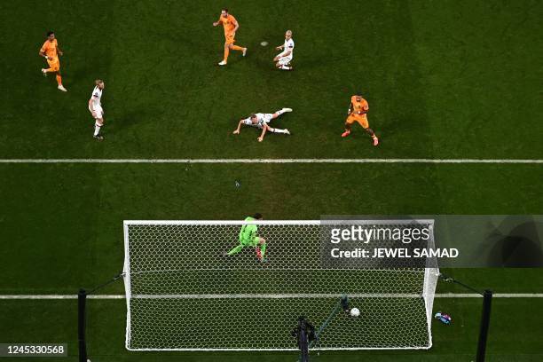 S goalkeeper Matt Turner concedes a goal by Netherlands' defender Daley Blind during the Qatar 2022 World Cup round of 16 football match between the...