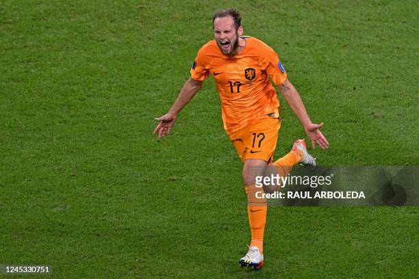 Netherlands' defender Daley Blind celebrates after scoring his team's second goal during the Qatar 2022 World Cup round of 16 football match between...