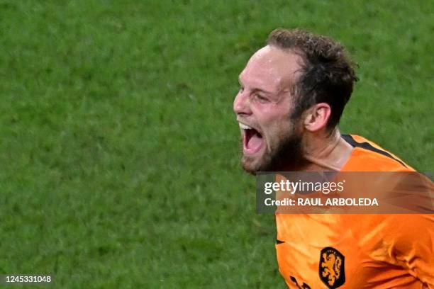 Netherlands' defender Daley Blind celebrates after scoring his team's second goal during the Qatar 2022 World Cup round of 16 football match between...