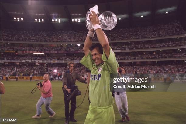 Imran Khan of Pakistan lifts the World Cup after Pakistan beat England in the final at Melbourne.