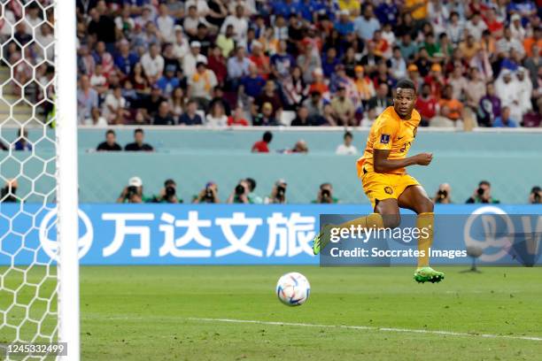 Denzel Dumfries of Holland scores the fourth goal to make it 3-1 during the World Cup match between Holland v USA at the Khalifa International...