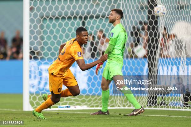 Denzel Dumfries of Netherlands celebrates after scoring a goal to make it 3-1 during the FIFA World Cup Qatar 2022 Round of 16 match between...