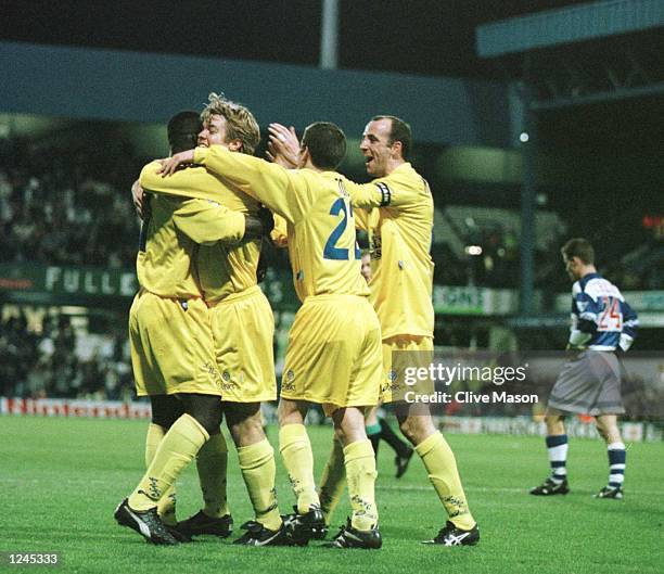 Tony Yeboah is congratulated by his teammates after scoring the opening goal for Leeds United during the FA Premiership game against the Queens Park...