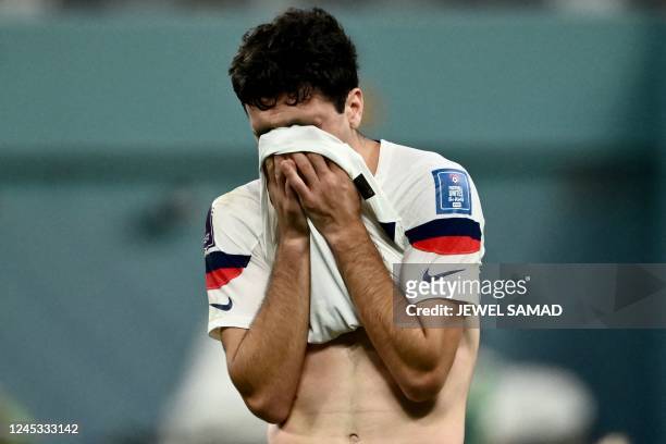 S forward Giovanni Reyna reacts at the end of the Qatar 2022 World Cup round of 16 football match between the Netherlands and USA at Khalifa...
