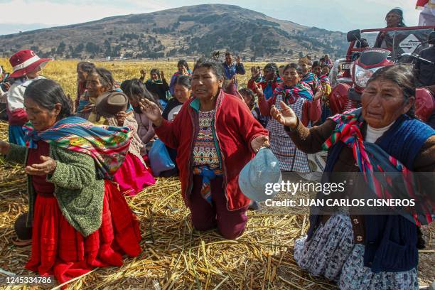 Members of the Aymara community of Ichu pray and take the Virgin of the Clouds on a pilgrimage to ask for rain in the area due to the drought they...