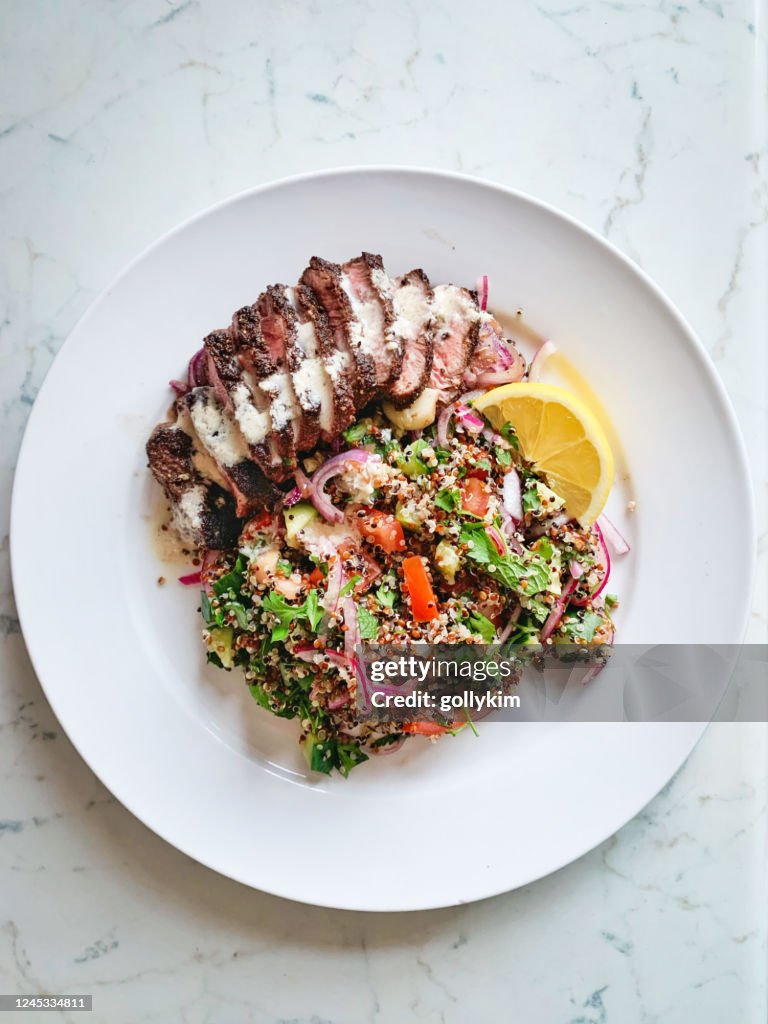 Homemade Shawarma steak with quinoa tabbouleh and tahini sauce