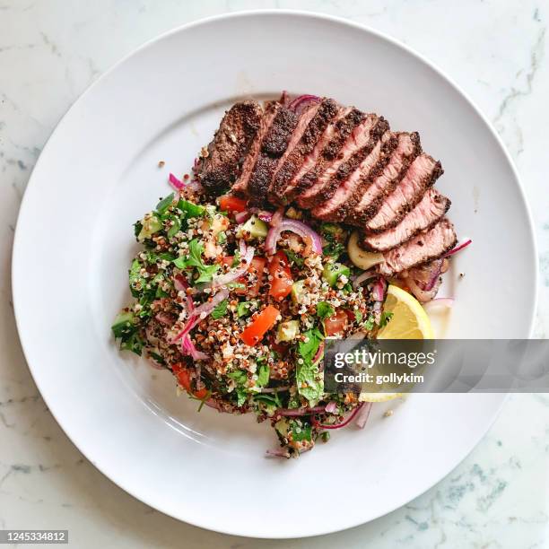 homemade shawarma steak with quinoa tabbouleh and tahini sauce - steak plate stock pictures, royalty-free photos & images