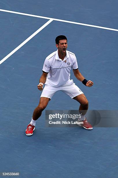 Novak Djokovic of Serbia reacts after he won his match against Roger Federer of Switzerland during Day Thirteen of the 2011 US Open at the USTA...