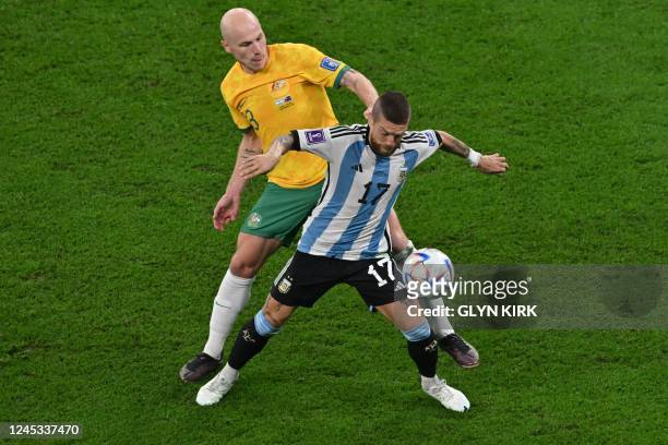 Argentina's midfielder Alejandro Gomez fights for the ball with Australia's midfielder Aaron Mooy during the Qatar 2022 World Cup round of 16...