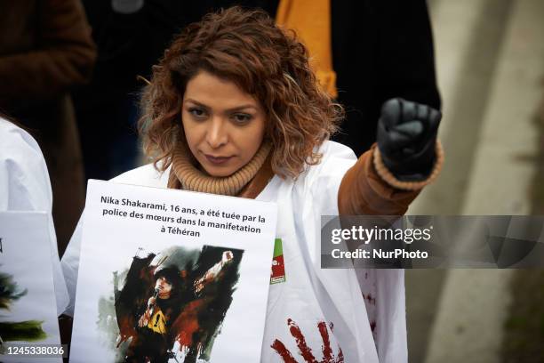 Woman walks with her fist raised. Iranians of Toulouse organized a protest in Toulouse in solidarity with women and protesters in Iran, following the...