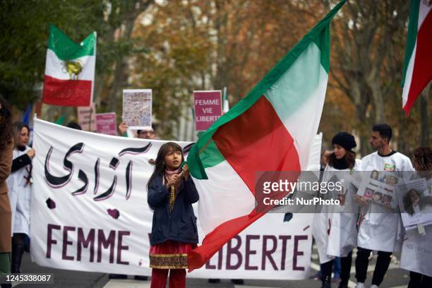 Young girl waves the Iranian flag. Iranians of Toulouse organized a protest in Toulouse in solidarity with women and protesters in Iran, following...