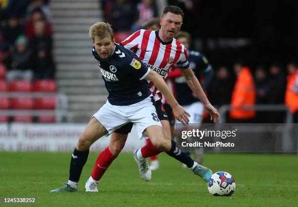 Sunderland's Corry Evans challenges Millwall's Billy Mitchell during the Sky Bet Championship match between Sunderland and Millwall at the Stadium Of...