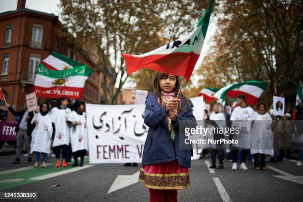 Young girl waves the Iranian flag. Iranians of Toulouse organized a protest in Toulouse in solidarity with women and protesters in Iran, following...