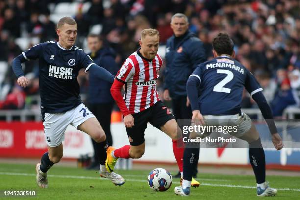 Sunderland's Alex Pritchard takes on defenders during the Sky Bet Championship match between Sunderland and Millwall at the Stadium Of Light,...