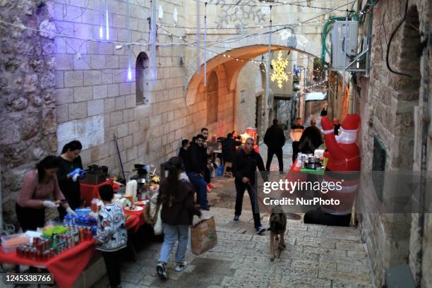 Palestinian Christians are taking part in a celebration of the Christmas market in Jerusalem, on December 3, 2022. Christmas is an annual festival...