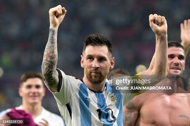Argentina's forward Lionel Messi celebrates after his team won the Qatar 2022 World Cup round of 16 football match between Argentina and Australia at...