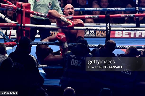 Britain's Tyson Fury fights against Britain's Derek Chisora during their WBC heavyweight title boxing match, at the Tottenham Hotspur stadium in east...