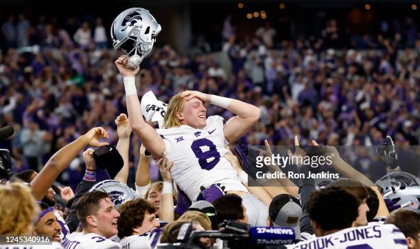 Ty Zentner of the Kansas State Wildcats is carried away by teammates after kicking the game winning field goal in overtime against the TCU Horned...