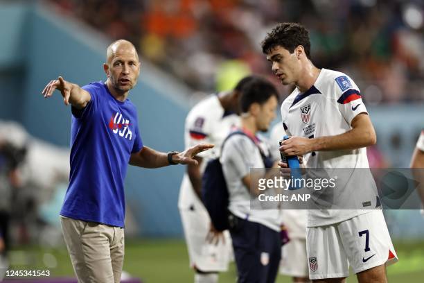 United States coach Gregg Berhalter, Giovanni Reyna of United States during the FIFA World Cup Qatar 2022 round of 16 match between Netherlands and...