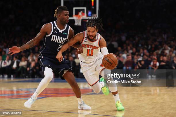Jalen Brunson of the New York Knicks drives to the net against Reggie Bullock of the Dallas Mavericks at Madison Square Garden on December 03, 2022...