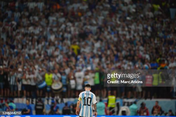 Lionel Messi of Argentina walks toward his fans during the FIFA World Cup Qatar 2022 Round of 16 match between Argentina and Australia at Ahmad Bin...