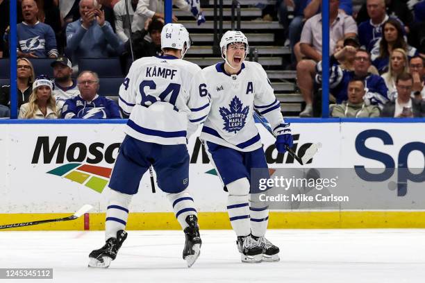 Mitchell Marner of the Toronto Maple Leafs celebrates his goal against the Tampa Bay Lightning with David Kampf during the second period of the game...