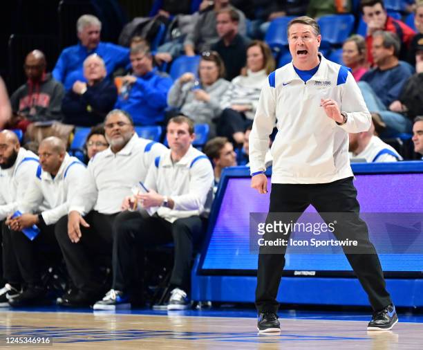 Saint Louis University head coach Travis Ford yells instructions to his team in the first half during a college basketball game between the Southern...
