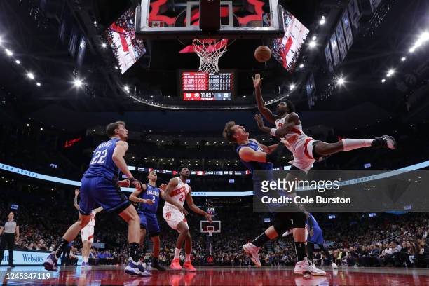 Anunoby of the Toronto Raptors puts up a shot over Moritz Wagner of the Orlando Magic during the first half of their NBA game at Scotiabank Arena on...