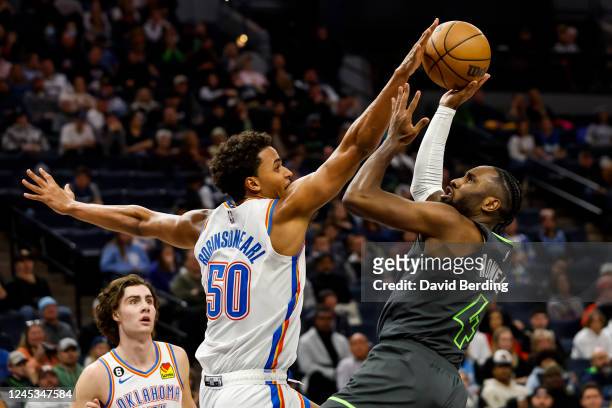 Jeremiah Robinson-Earl of the Oklahoma City Thunder fouls Jaylen Nowell of the Minnesota Timberwolves in the fourth quarter of the game at Target...