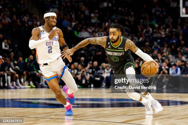 Angelo Russell of the Minnesota Timberwolves drives to the basket while Shai Gilgeous-Alexander of the Oklahoma City Thunder defends in the third...