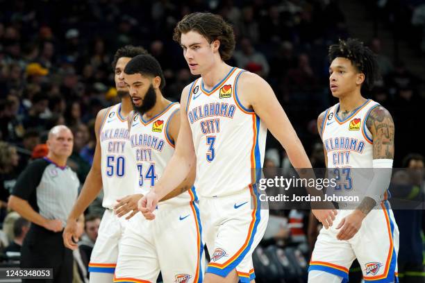 Jeremiah Robinson-Earl, Kenrich Williams, Josh Giddey, and Tre Mann of the Oklahoma City Thunder on the court during the game against the Minnesota...